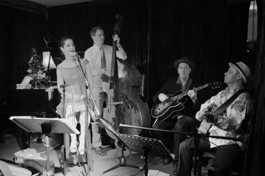 The Irwell Street String Band with Hetty Kate, Sam Lemann, Andy Baylor and Leigh Barker performing together on stage in Melbourne